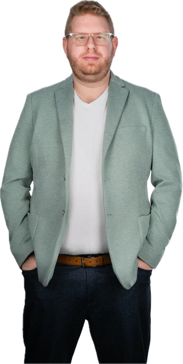 Alec McCauley, standing with his hands in his pockets